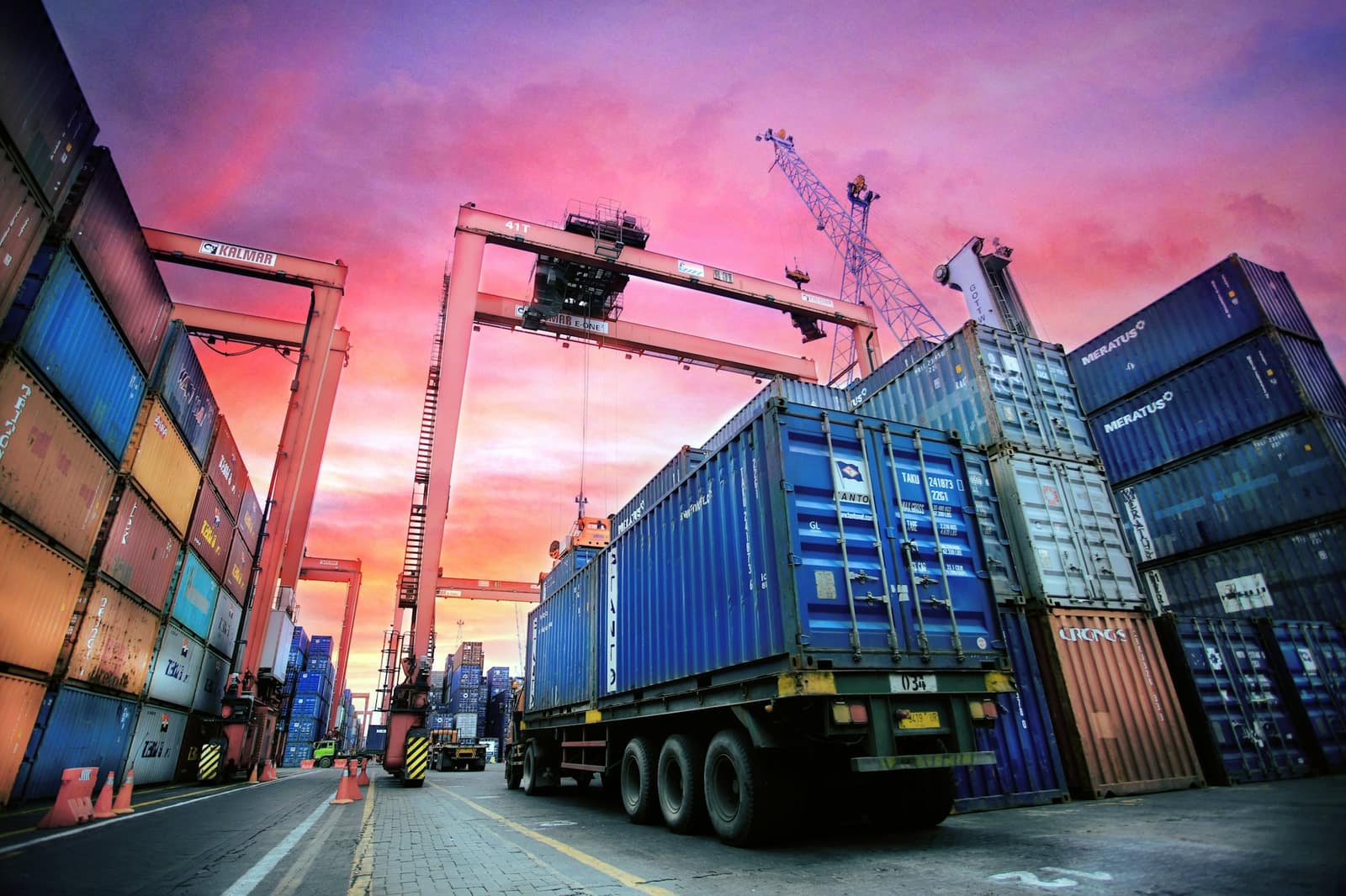 A deep-water Atlantic container port in Portugal, gantry cranes over the quay, where goods enter the EU customs union.